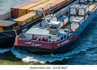 Cologne, Germany - May 5 2016: Cargo Ship ST. ANTONIUS II (ENI 02332893, Built In 2010) As Pusher Train With A Barge Towed Alongside On The River Rhine I