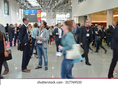 Cologne, Germany - September 16, 2015 - Young Business People Rushing By On Digital Marketing Exhibition And Trade Show Dmexco
