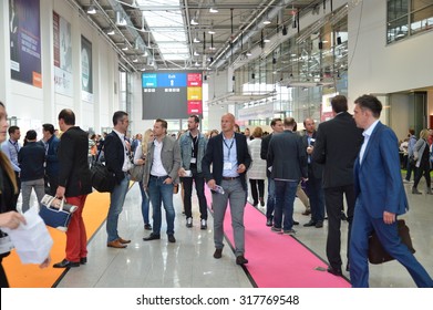 Cologne, Germany - September 16, 2015 - Young Business People Rushing By On Digital Marketing Exhibition And Trade Show Dmexco
