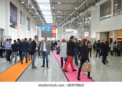 Cologne, Germany - September 16, 2015 - Young Business People Rushing By On Digital Marketing Exhibition And Trade Show Dmexco