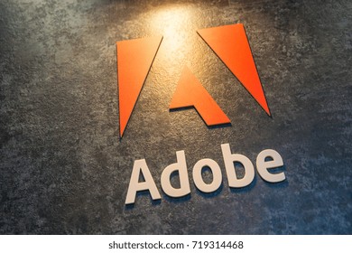 COLOGNE, GERMANY SEPTEMBER, 2017: Adobe Systems Logo. Adobe is a multinational software company that produces and sells multimedia and creativity software.