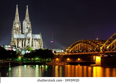 Cologne Gothic Cathedral at night as seen from the Rehin - Powered by Shutterstock