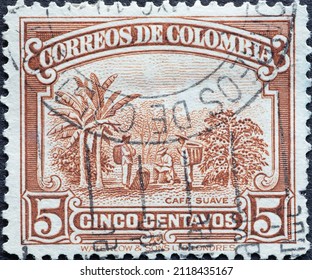 Colombia - circa 1936 : a postage stamp from Colombia, showing a coffee plantation with farmers and coffee bushes