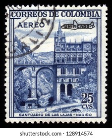 COLOMBIA - CIRCA 1954: A stamp printed in Colombia shows Las Lajas Sanctuary, minor basilica church in the southern Colombia, Narino, blue, circa 1954