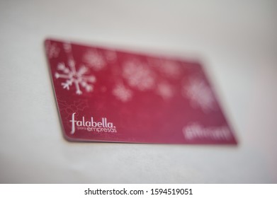 BOGOTÁ, COLOMBIA - DECEMBER 20, 2019: Pre Paid Fallabella Department Store Holiday And Christmas Red Business Gift Card.