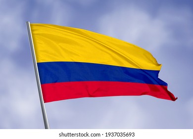 Colombia flag isolated on sky background. close up waving flag of Colombia. flag symbols of Colombia.