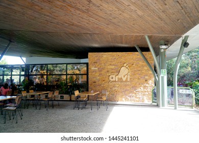 Medellín, Colombia; July 07 2019: People Enjoy A Healthy Trip In The Public Park Arvi In The City Of Medellin, With A Lot Of Trees, Wood Bridge And A River