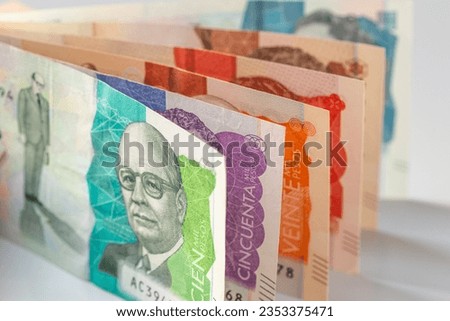 Colombia money, Colombian pesos, Stacked various banknotes, 10 thousand pesos banknote, Financial and business concept