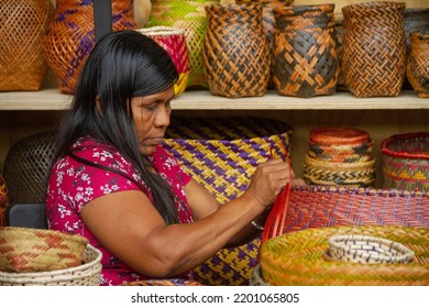 MEDELLÍN, COLOMBIA - September 12, 2022: 
Expoartesanos Colombia 2022.Indigenous Woman Making A Typical Basket. Artisan Woman. Wicker Work, Hand Made. 