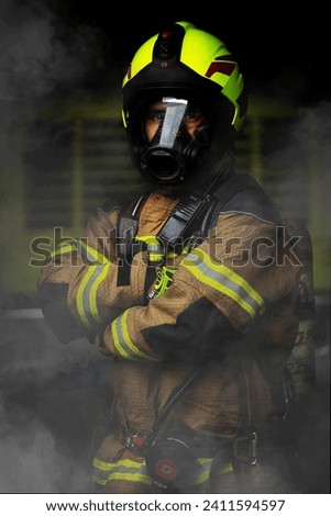 A Colombian firefighter uses his fire protection