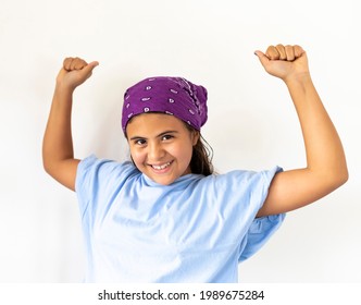 Colombian Teen Girl With Scarf With Raised Hands In Sign Of Victory