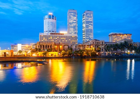 Colombo city skyline and Beira lake chanel at sunset. Colombo is the commercial capital and largest city of Sri Lanka.