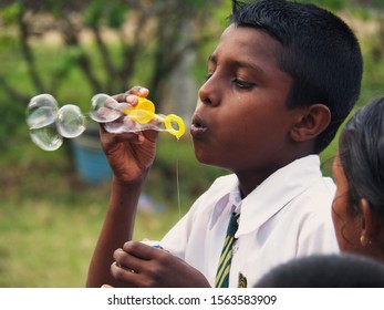 Colombo, Sri Lanka 10. August 2018: Sri Lanka Boy Blows Bubbles And Having Fun
