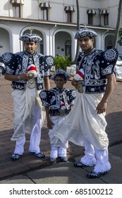 COLOMBO, SRI LANKA - AUGUST 06, 2012 : A Groom With Wedding Party Members Stand Near Galle Face Green In Colombo. They Are Dressed In Traditional Sri Lankan Costumes.