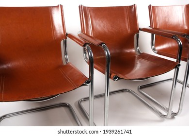 Colombo Tan Leather And Chrome Armchairs Designed By Marcel Breuer On A White Background