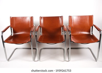 Colombo Tan Leather And Chrome Armchairs Designed By Marcel Breuer On A White Background