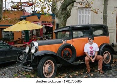 Colonia Del Sacramento Uruguay - 2016: Man Waiting Sitting In Vintage Car On Colonia Del Sacramento Street. 