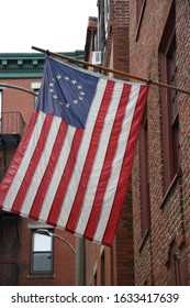 Colonial Flag Hanging From A Wall In Boston, MA