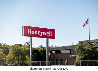 Colonial Heights, USA - October 18, 2021: Honeywell International Inc Manufacturer Company Office Building Entrance Sign With American Flag On Pole Flagpole In Virginia With Nobody