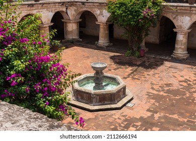 colonial style fountain in the city of antigua guatemala - Shutterstock ID 2112666194