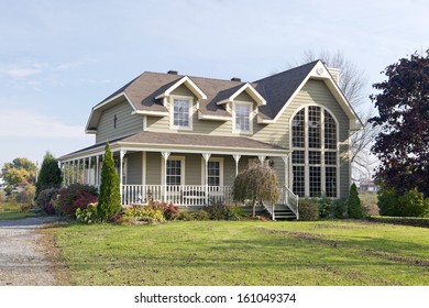 Colonial Style Home With Large Arched Window