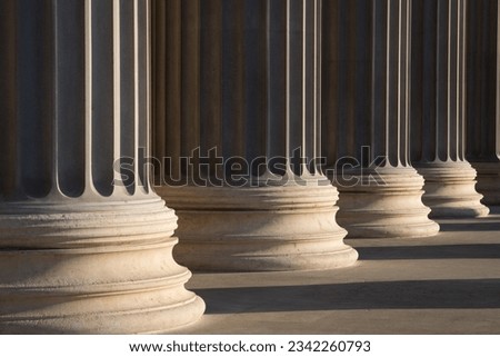 Colonnade of Ionic order columns, close up.