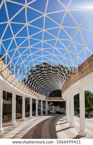colonnade with openwork ceiling.