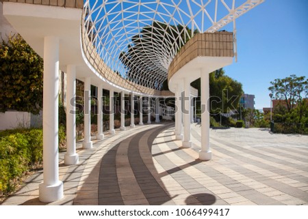 colonnade with openwork ceiling.