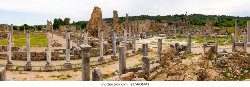 Colonnades in agora of Perge with view of Hellenistic Gate. Antalya Province, Turkey.