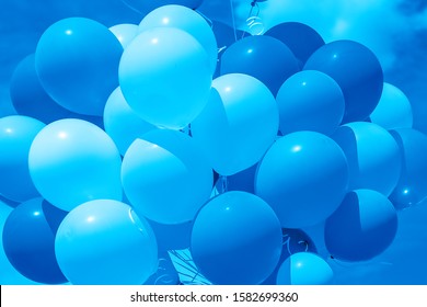 Color Of 2020 Year, Classic Blue. Group Of Balloons With Helium On The Sky Background. Trend Color