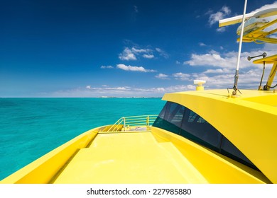 Color Of 2021 - Illuminating Yellow Catamaran In Caribbean Sea, Cancun, Mexico 