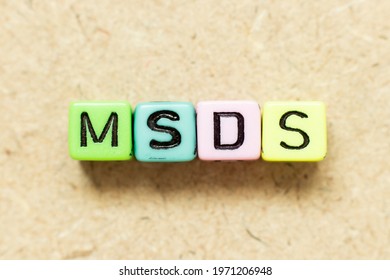 Color Alphabet Letter Block In Word MSDS (Abbreviation Of Material Safety Data Sheet) On Wood Background