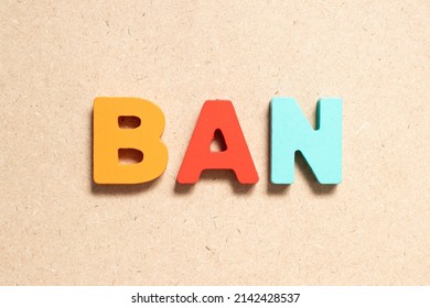 Color alphabet letter in word ban on wood background - Shutterstock ID 2142428537
