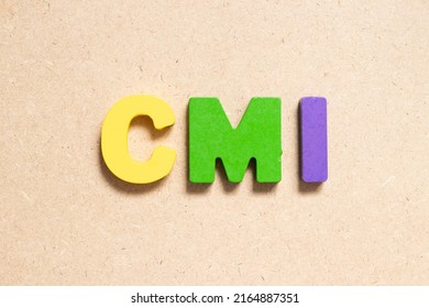 Color Alphabet Letter In Word CMI (Abbreviation Of Cost Management Index, Co-managed Inventory,Customer Managed Inventory Or Case Mix Index) On Wood Background