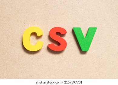 Color Alphabet Letter In Word CSV (Abbreviation Of Computer System Validation Or Comma-separated Values) On Wood Background