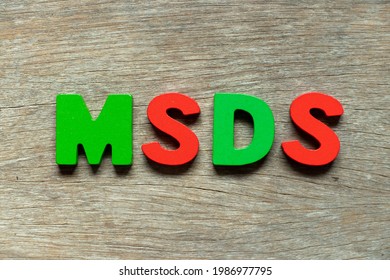 Color Alphabet Letter In Word MSDS (Abbreviation Of Material Safety Data Sheet) On Wood Background