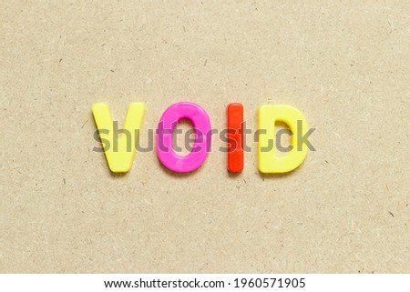 Color alphabet letter with word void on wood background