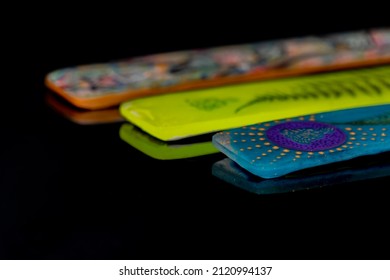 Color Aromatic Stick Holder On Dark Black Shiny Table