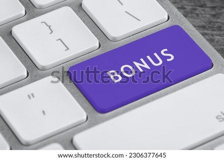 Color button with word Bonus on computer keyboard, closeup