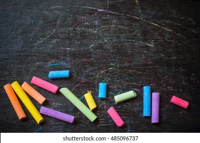 Color chalk on desk background - Powered by Shutterstock