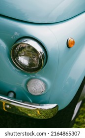 Color Close Up Of A Cyan Vintage Car Headlight And Turn Signal.