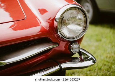 Color Close Up Of A Red Vintage Car Headlight And Turn Signal.