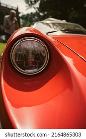 Color Close Up Of A Red Vintage Car Headlight And Turn Signal.