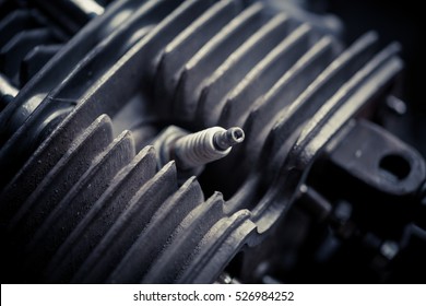 Color Close Up Shot Of A Motorcycle Piston And Spark Plug.