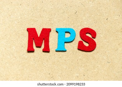 Color Cloth Alphabet Letter In Word MPS (Abbreviation Of Master Production Schedule Or Mucopolysaccharidosis) On Wood Background