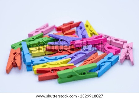 Color clothes pegs on a white background, clothes clip