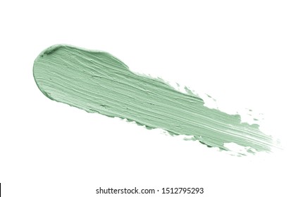 Color Correcting Concealer Stroke Isolated On White Background. Mint Green Corrector Cream Smudge Smear Swatch Sample. Makeup Base Foundation Creamy Texture