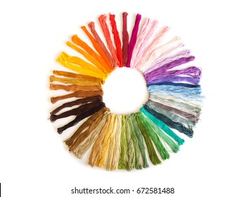 Color Cross Stitch Embroidery On White Background. Colorful Fabric. Material Of Craft. Favorite Hobby. Top View. Sort By Color Shade In Circle Shape.