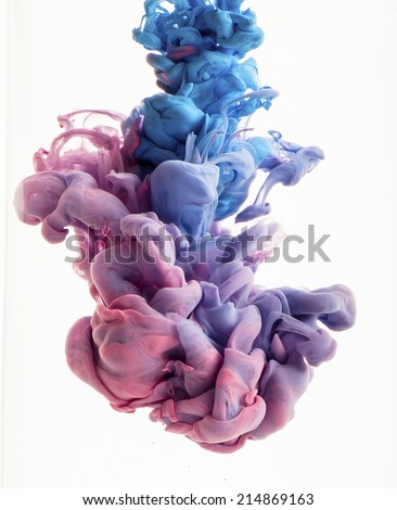 Color drop in water, photographed in motion. Ink swirling in water. Cloud of silky ink in water isolated on white background. Colorful ink in water, ink drop.