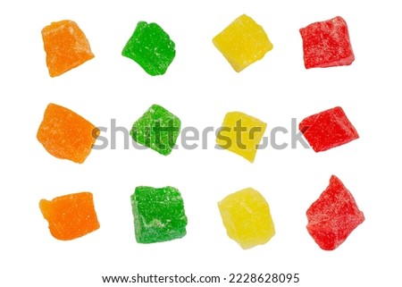Color dry candied fruits isolated on white background, top view. Multicolored dried fruit candies isolated on white background, top view. Pieces of candied fruits isolated on white, top view.